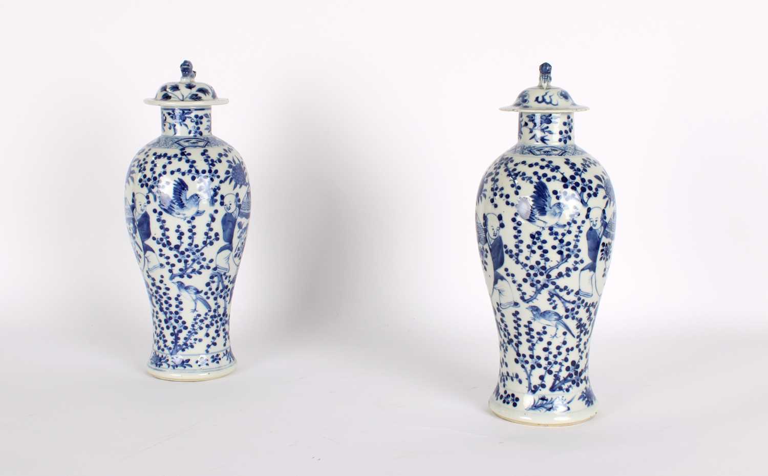 Lot 10 - A Pair of Late 19th Century Chinese Blue and White Slender 'Meiping' Vases with Covers