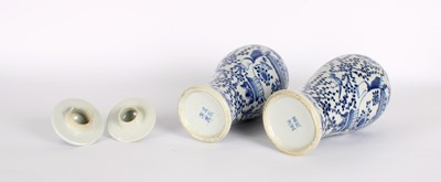 Lot 10 - A Pair of Late 19th Century Chinese Blue and White Slender 'Meiping' Vases with Covers