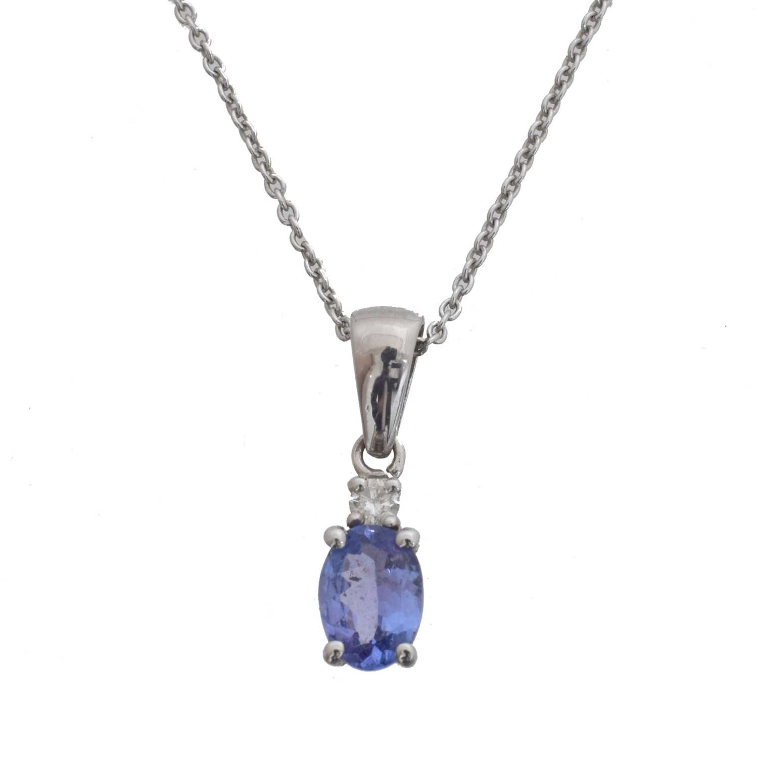 Lot 23 - A tanzanite and diamond pendant.