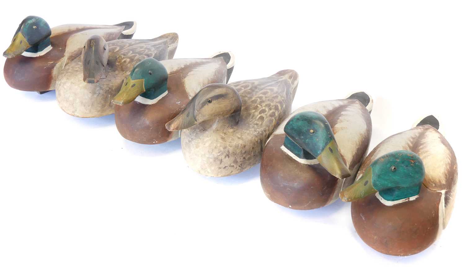 Lot 464 - Six wood decoy ducks, made originally to be a...
