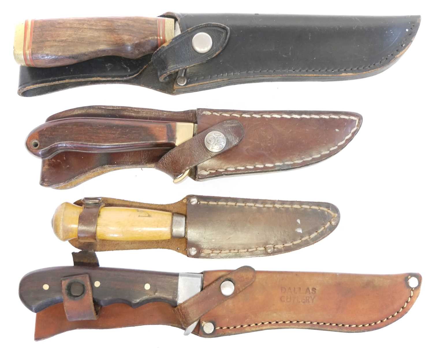 Lot 131 - Four hunting knifes, with slightly curved...