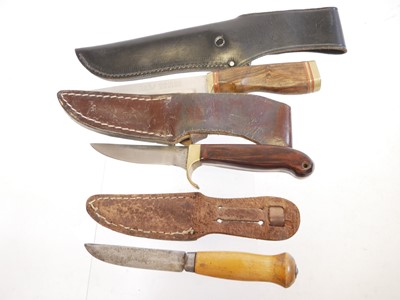 Lot 131 - Four hunting knifes, with slightly curved...