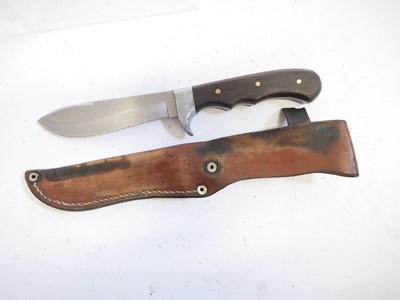 Lot 131 - Four hunting knifes, with slightly curved...