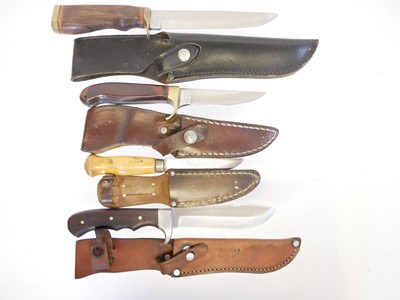 Lot 131 - Four hunting knifes, with slightly curved...