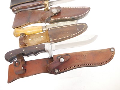 Lot 131 - Four hunting knifes, with slightly curved...