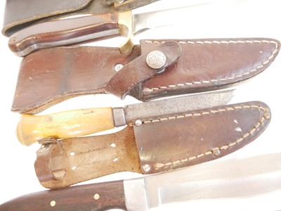 Lot 131 - Four hunting knifes, with slightly curved...