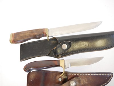 Lot 131 - Four hunting knifes, with slightly curved...