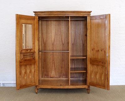 Lot 176 - A Walnut Bowfront Wardrobe from the "Spire" Range by Frank Hudson Ltd.