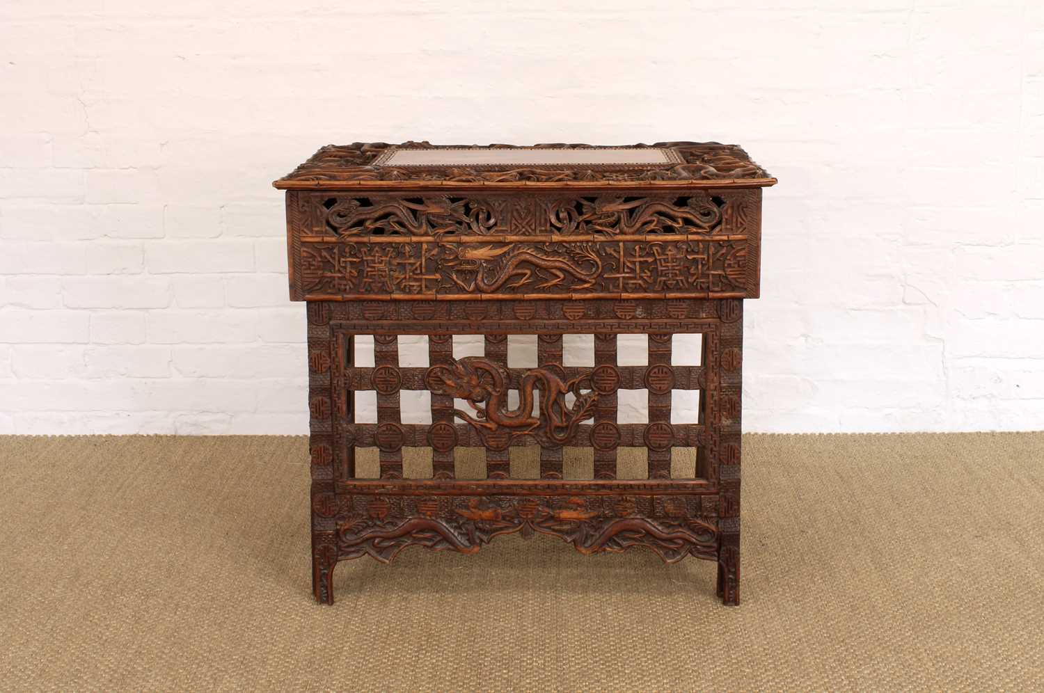 Lot 194 - A Late 19th/Early 20th Century Burmese Table with Folding Legs