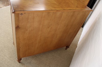 Lot 177 - A Walnut Bowfront Chest of Drawers from the "Spire" Range by Frank Hudson Ltd.