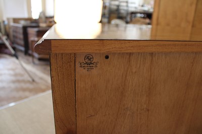 Lot 177 - A Walnut Bowfront Chest of Drawers from the "Spire" Range by Frank Hudson Ltd.