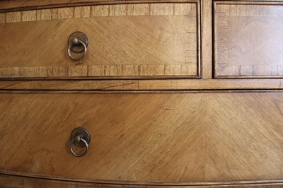 Lot 177 - A Walnut Bowfront Chest of Drawers from the "Spire" Range by Frank Hudson Ltd.