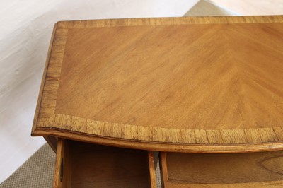 Lot 175 - A Walnut Bowfront Dressing Table, Mirror and Stool from the "Spire" Range by Frank Hudson Ltd.