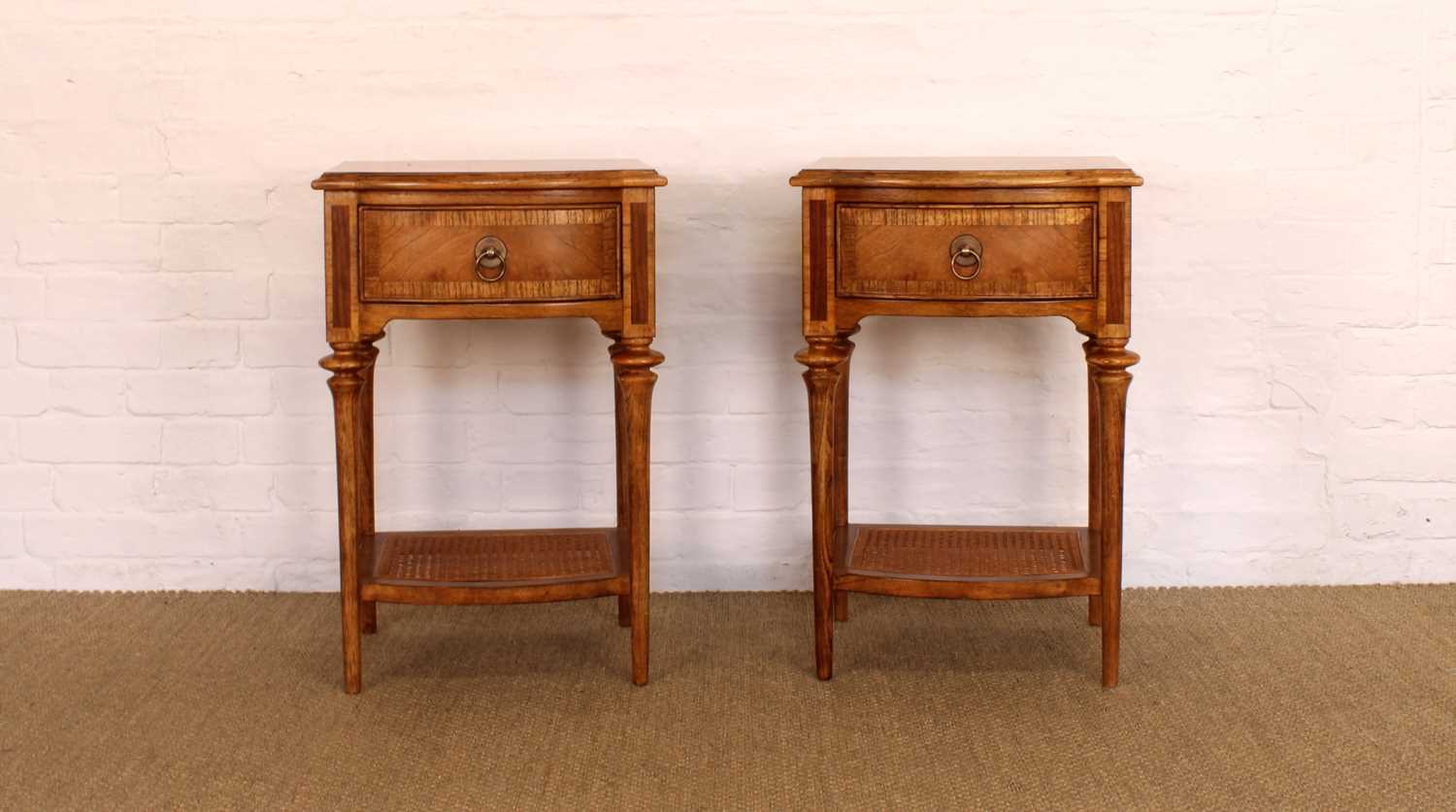 Lot 174 - A Pair of Walnut Bowfront Bedside Tables from the "Spire" Range by Frank Hudson Ltd.