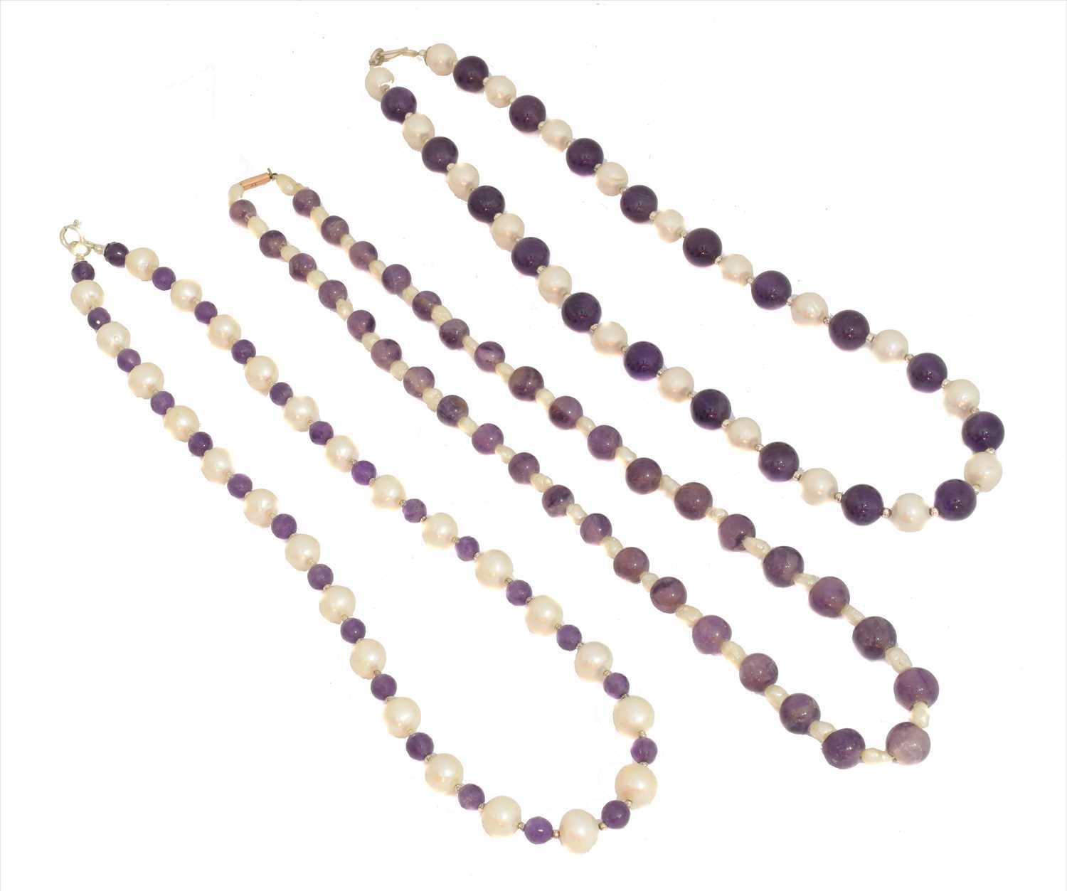 Lot 49 - Three amethyst and cultured pearl necklaces