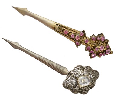 Lot Two Sri Lankan silver gilt Kondakoora hairpins.