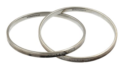 Lot A sterling silver Tiffany & Co. interlocking double bangle