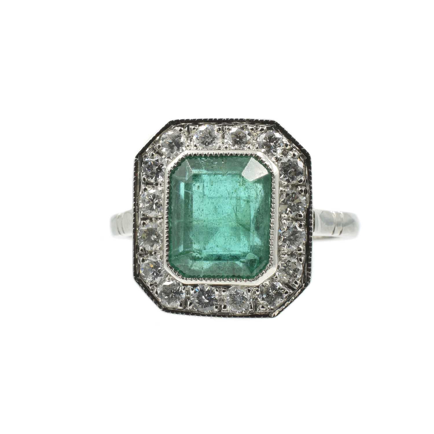 Lot 5 - A platinum, emerald and diamond art deco ring