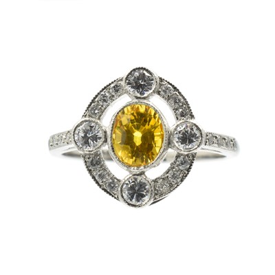 Lot A yellow sapphire and diamond art deco ring set in platinum