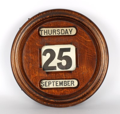 Lot 189 - A Country House Style Oak Perpetual Calendar