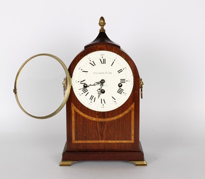 Lot 104 - A Reproduction Mahogany Chiming and Striking Mantel Clock in the Regency Style