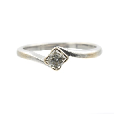 Lot A diamond twist solitaire ring set in white gold