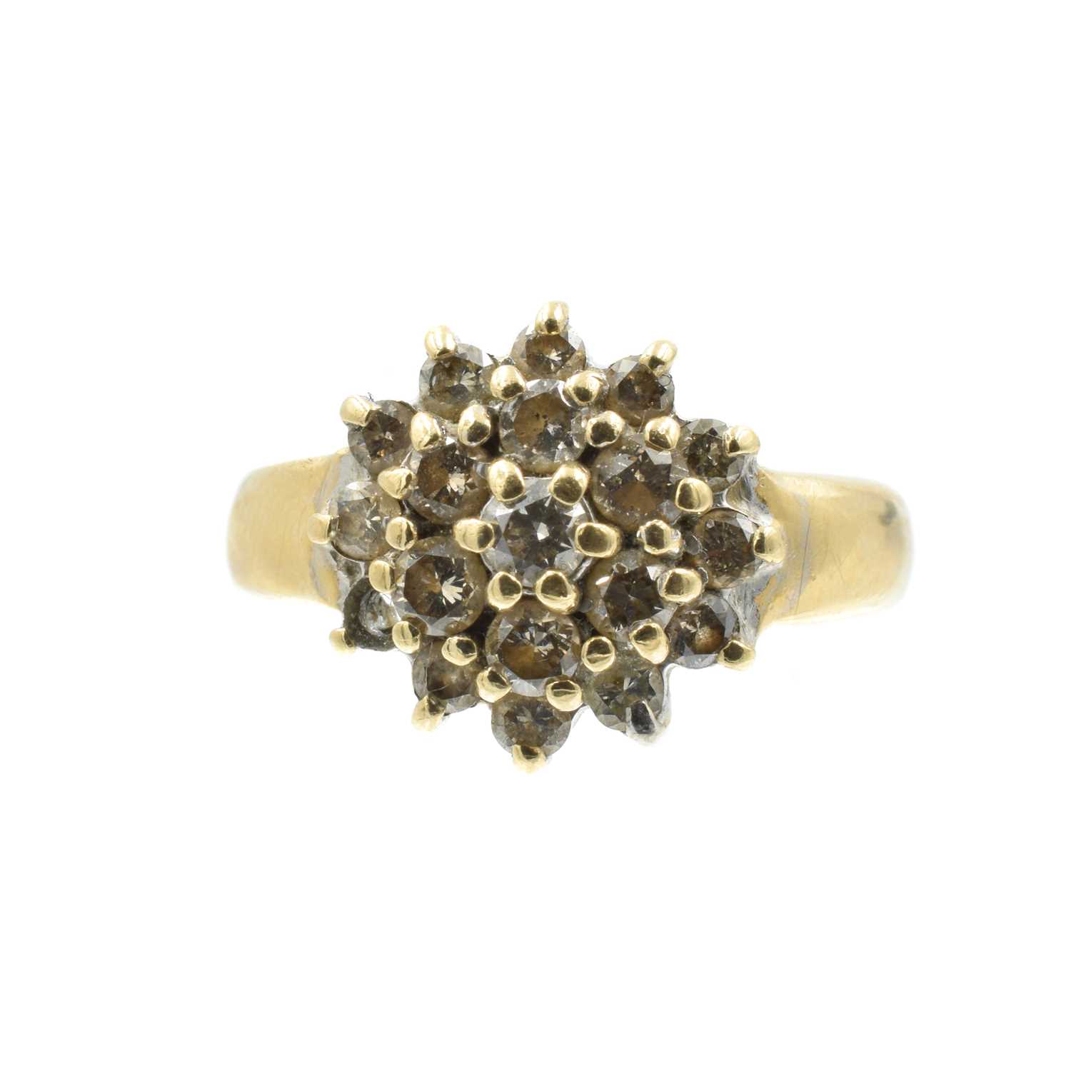 Lot A diamond and gold cluster ring