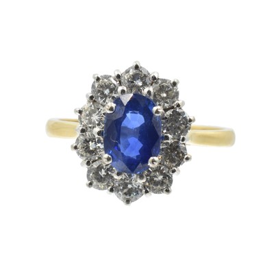Lot An oval cut 2.00ct sapphire and diamond cluster ring set in 18ct gold