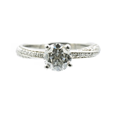 Lot A round cut 0.90ct diamond and platinum twist solitaire ring