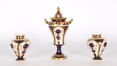 Lot 85 - An Early 20th Century Lidded Urn and Pair of Miniature Vases by Royal Crown Derby