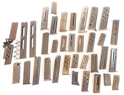 Lot 457 - Thirty four mixed pistol magazines, also some...