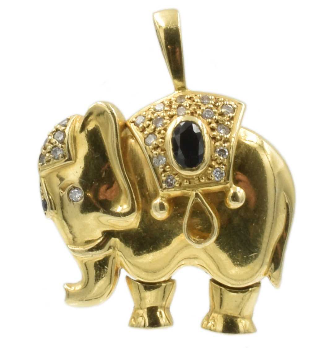 Lot An 18ct yellow gold, diamond and sapphire Indian elephant pendant