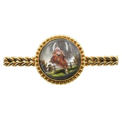 Lot 81 - A 9ct gold equestrian crystal brooch