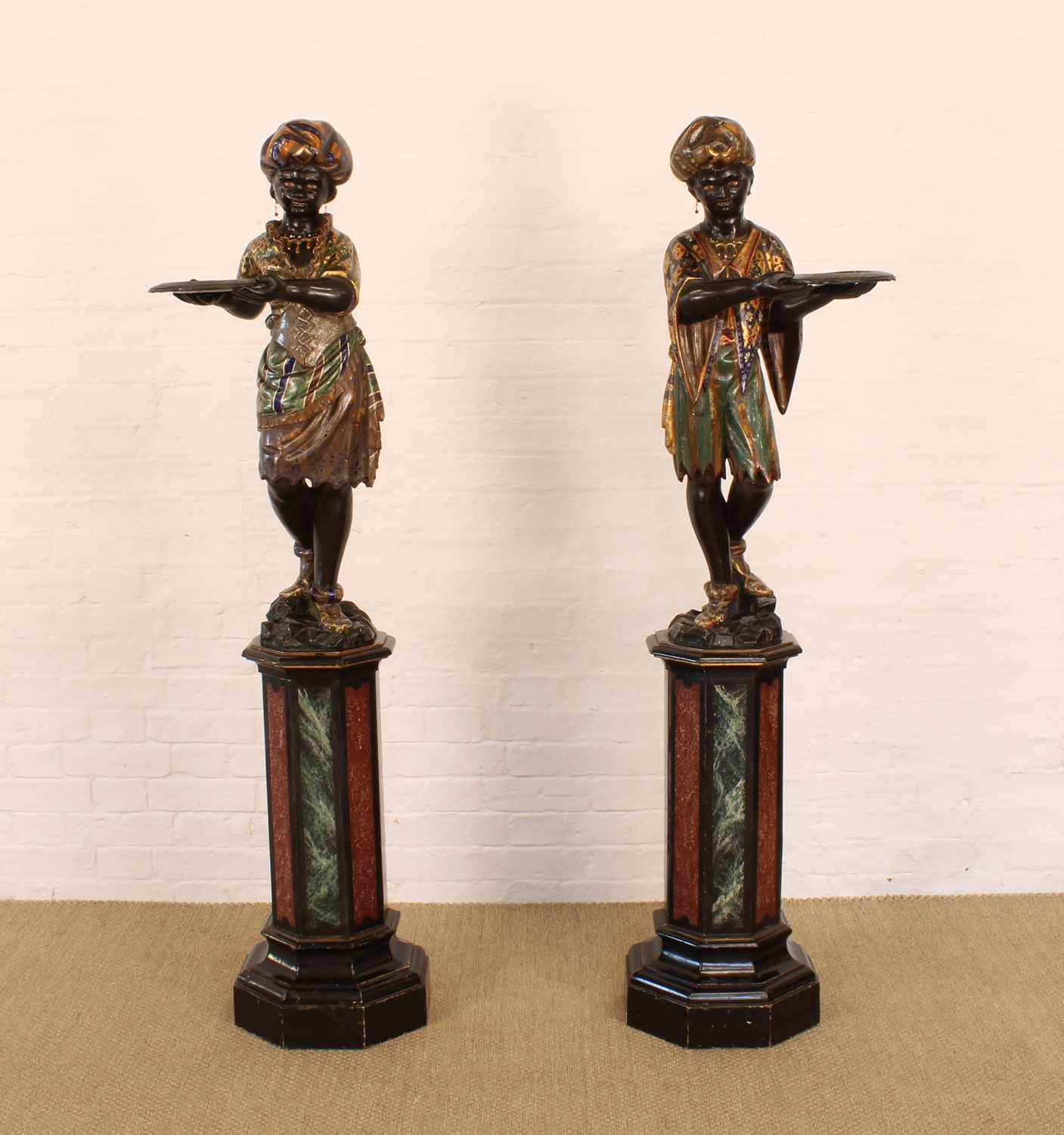 Lot A Rare Pair of 19th Century Venetian 'Blackamoor' Figures on Integral Stands