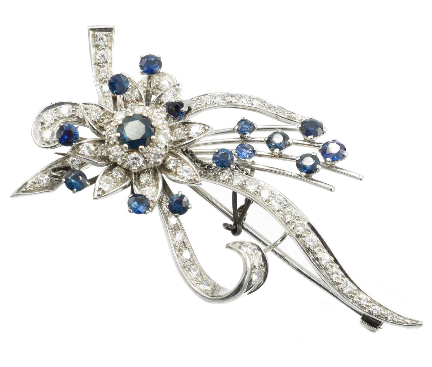 Lot 97 - A diamond and sapphire spray brooch, set in platinum
