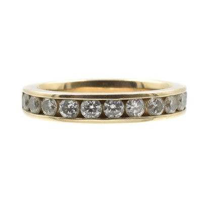 Lot 73 - A 1.00ct diamond half eternity ring, set into 9ct yellow gold