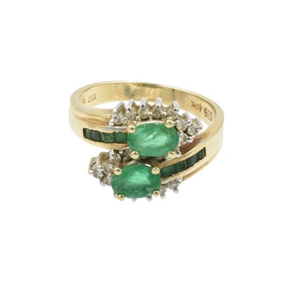 Lot 1 - An emerald and diamond stylised cluster ring set in 18ct yellow gold