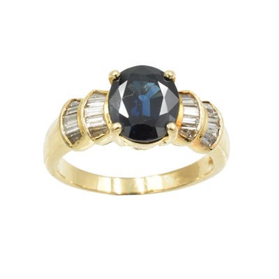 Lot 224 - A sapphire and diamond "croissant" style ring