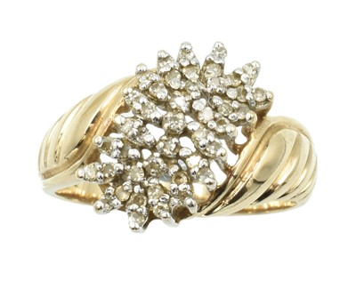 Lot 120 - A 9ct gold and diamond "croissant" style ring