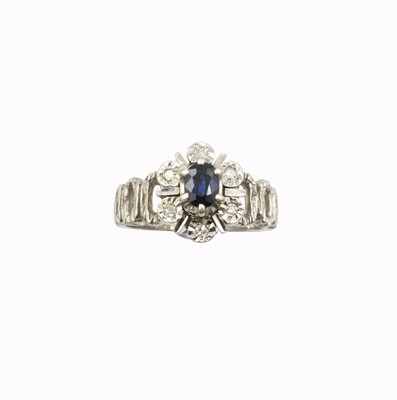 Lot An 18ct white gold, diamond, and sapphire cluster ring