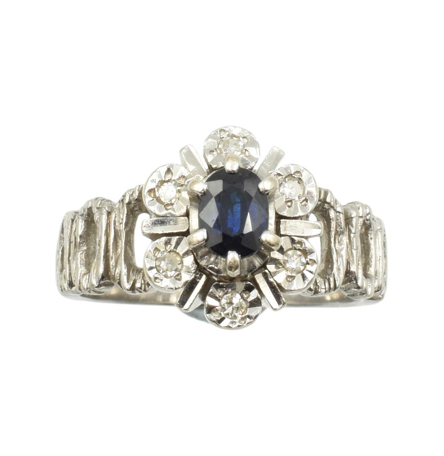 Lot 53 - An 18ct white gold, diamond, and sapphire cluster ring