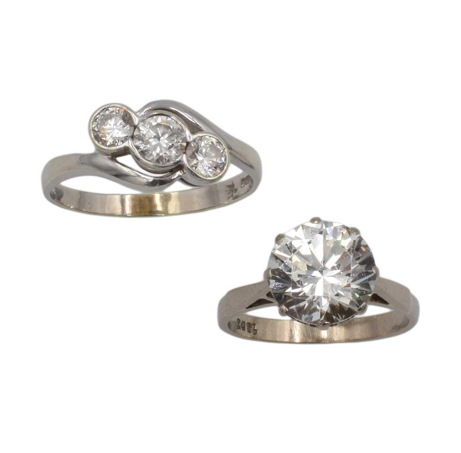 Lot 139 - Two cubic zirconia rings set in both 9ct and 18ct white gold