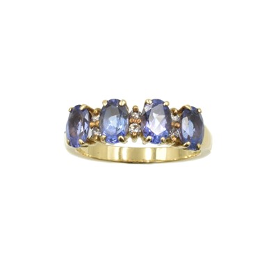 Lot 175 - An 18ct gold, tanzanite and diamond 4 stone ring