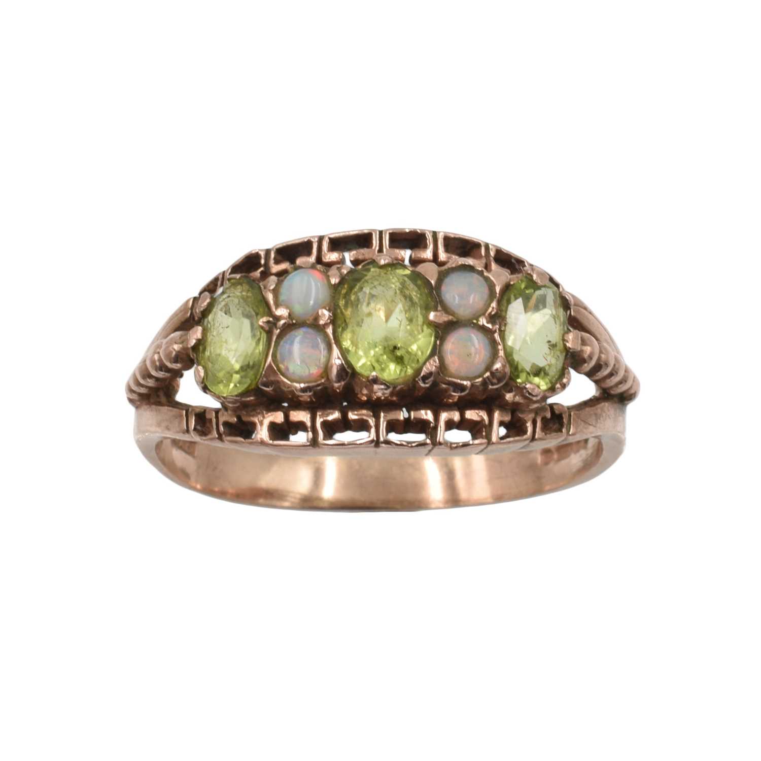 Lot A peridot and opal boat ring set in 9ct rose gold