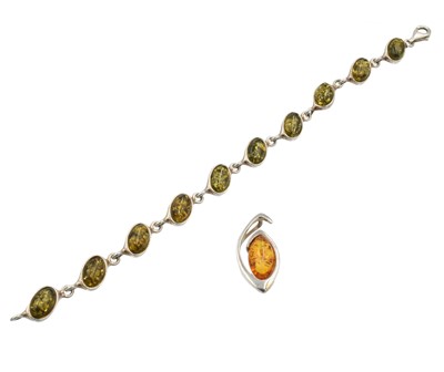 Lot 103 - An amber and silver bracelet and pendant