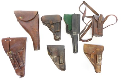 Lot Six leather pistol holsters, also twin...