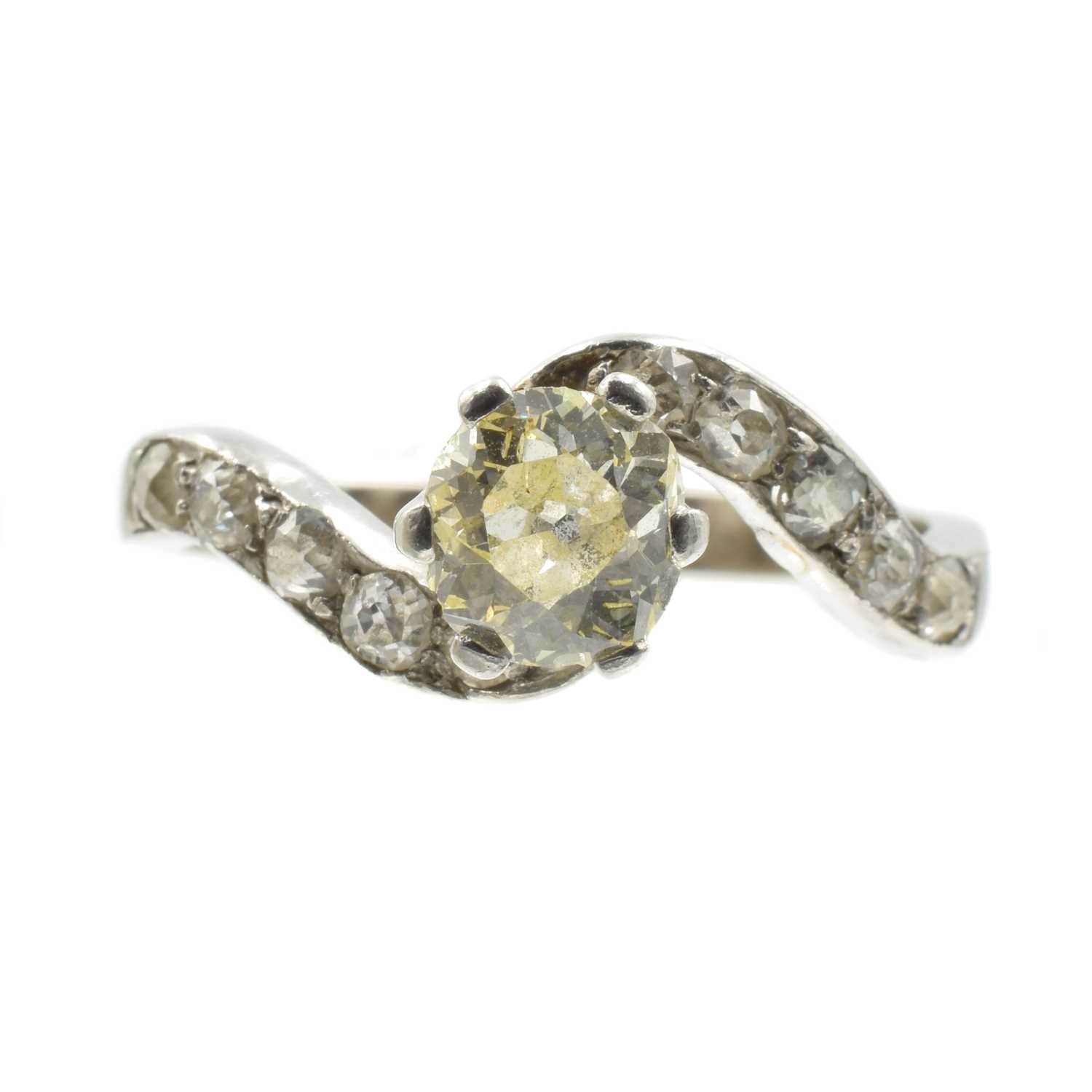 Lot A diamond solitaire twist ring, set in 18ct gold