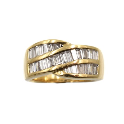 Lot 29 - An 18ct gold and diamond cross-over ring