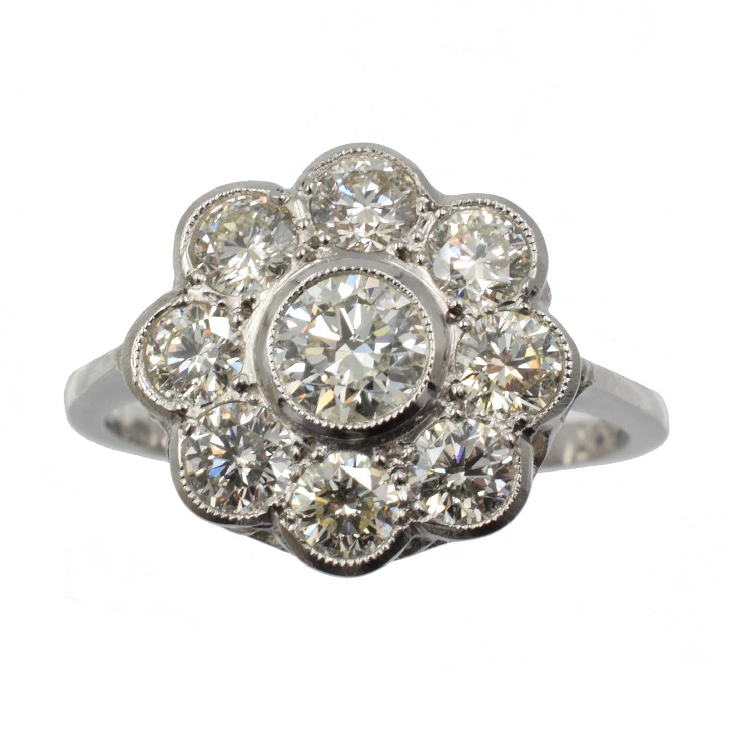 Lot 130 - A diamond and platinum daisy ring