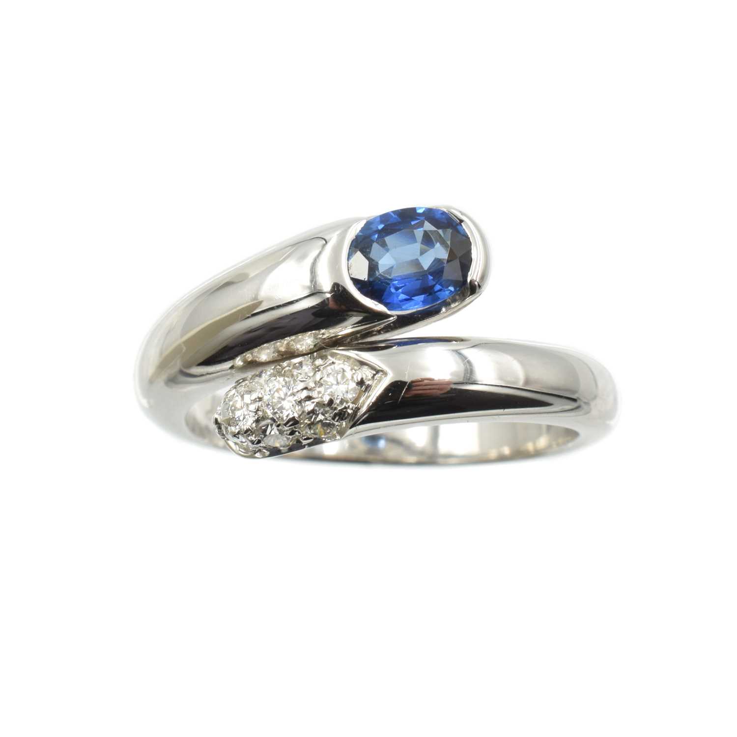 Lot A sapphire and diamond crossover ring, set in Platinum, by Bulgari